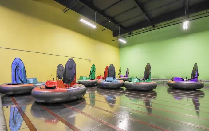 Indoor bumper cars attraction at SacTag for corporate team events.