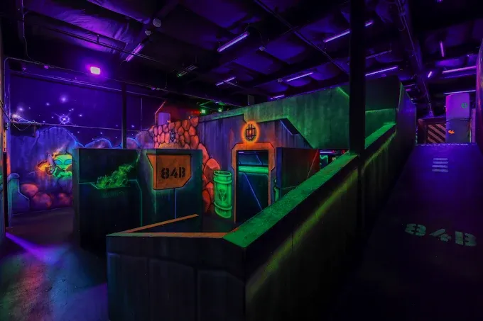 Live combat action inside our neon-drenched corridors. Watch players strategize across two stories of tactical terrain — an 8,500 sq. ft. vertical battlefield that makes every flat arena in Sacramento obsolete. Serving Sacramento, Folsom, Elk Grove, Roseville, and Rancho Cordova.